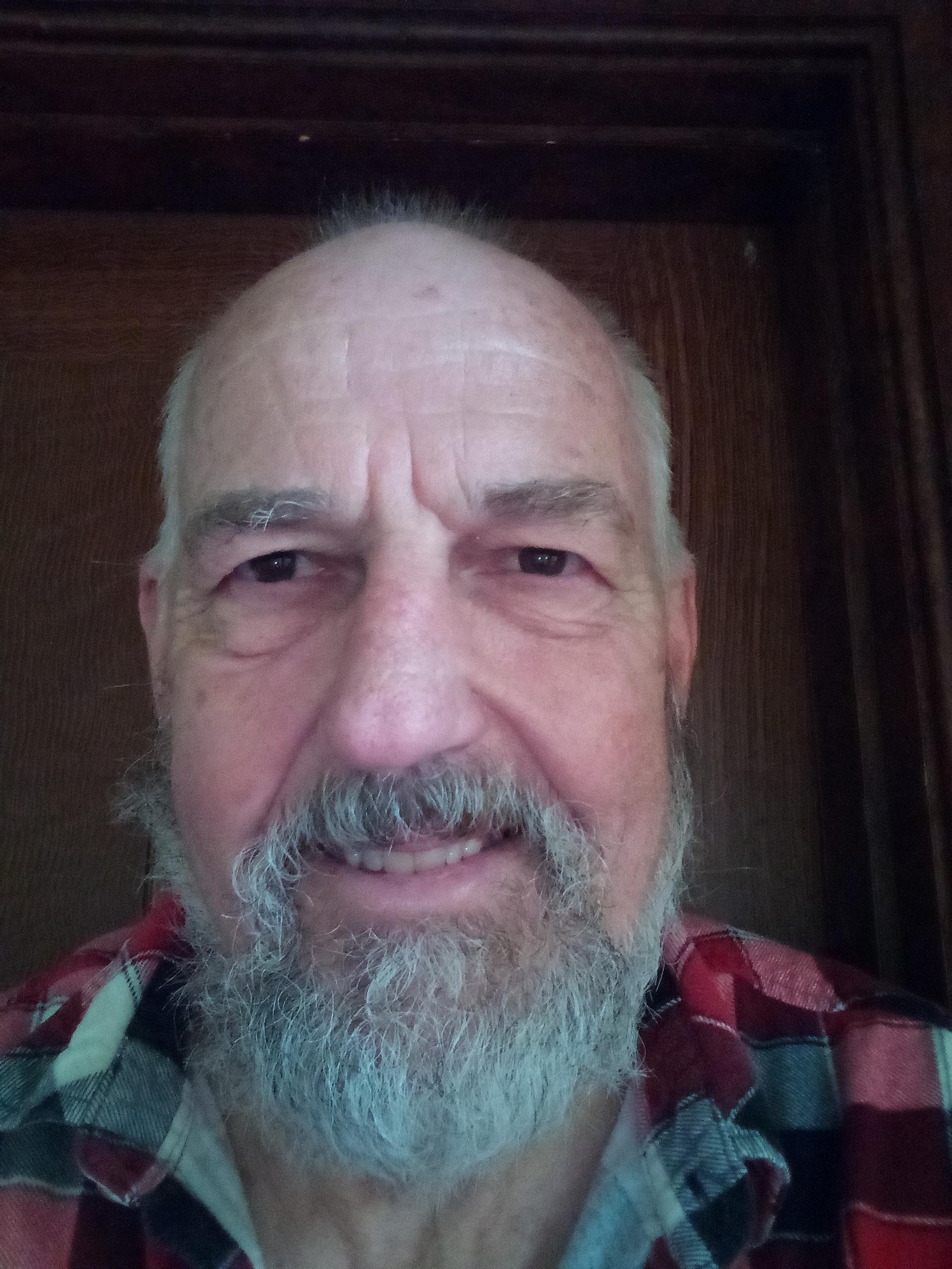 a bald man with a beard